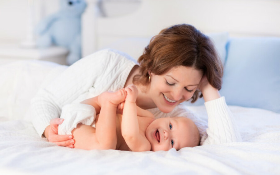 Mother and baby smiling