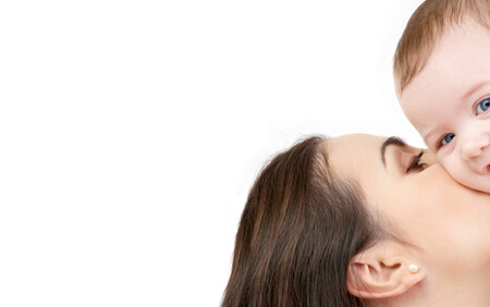 Mum kissing baby