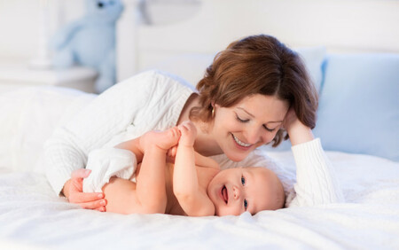 Mother and baby smiling