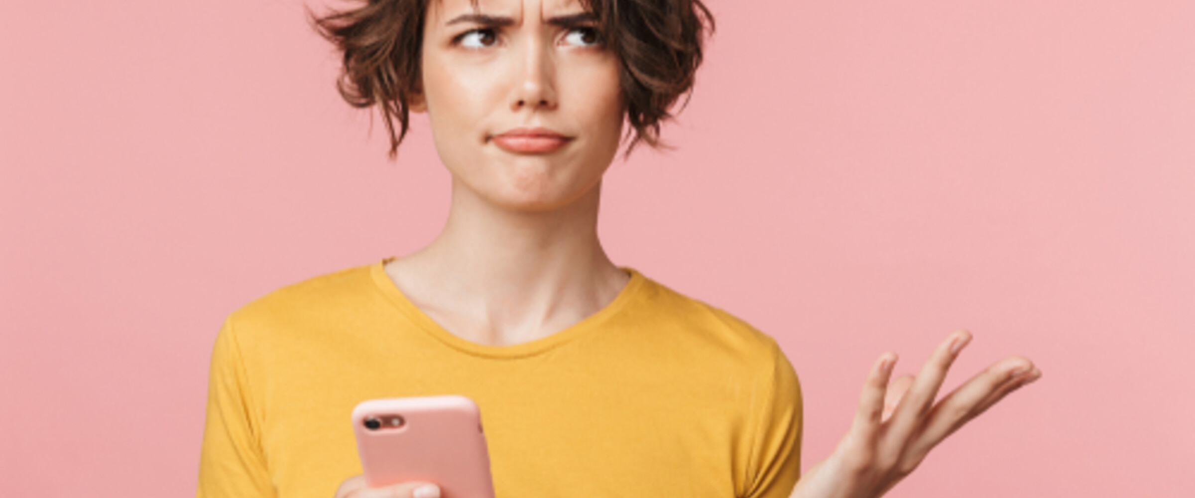 confused woman holding a phone